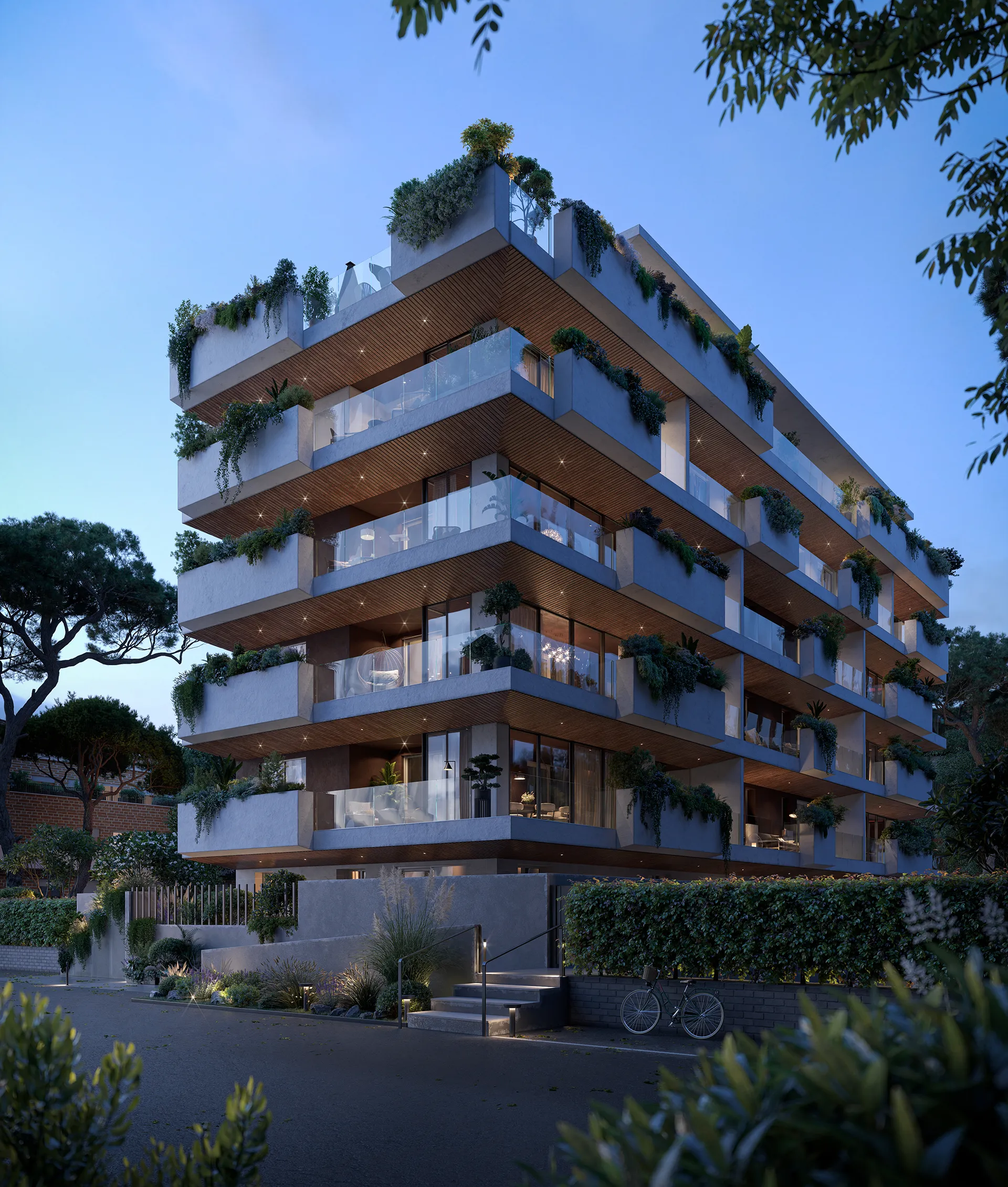 Modern multi-story apartment building with large balconies, glass railings, and greenery at dusk.
